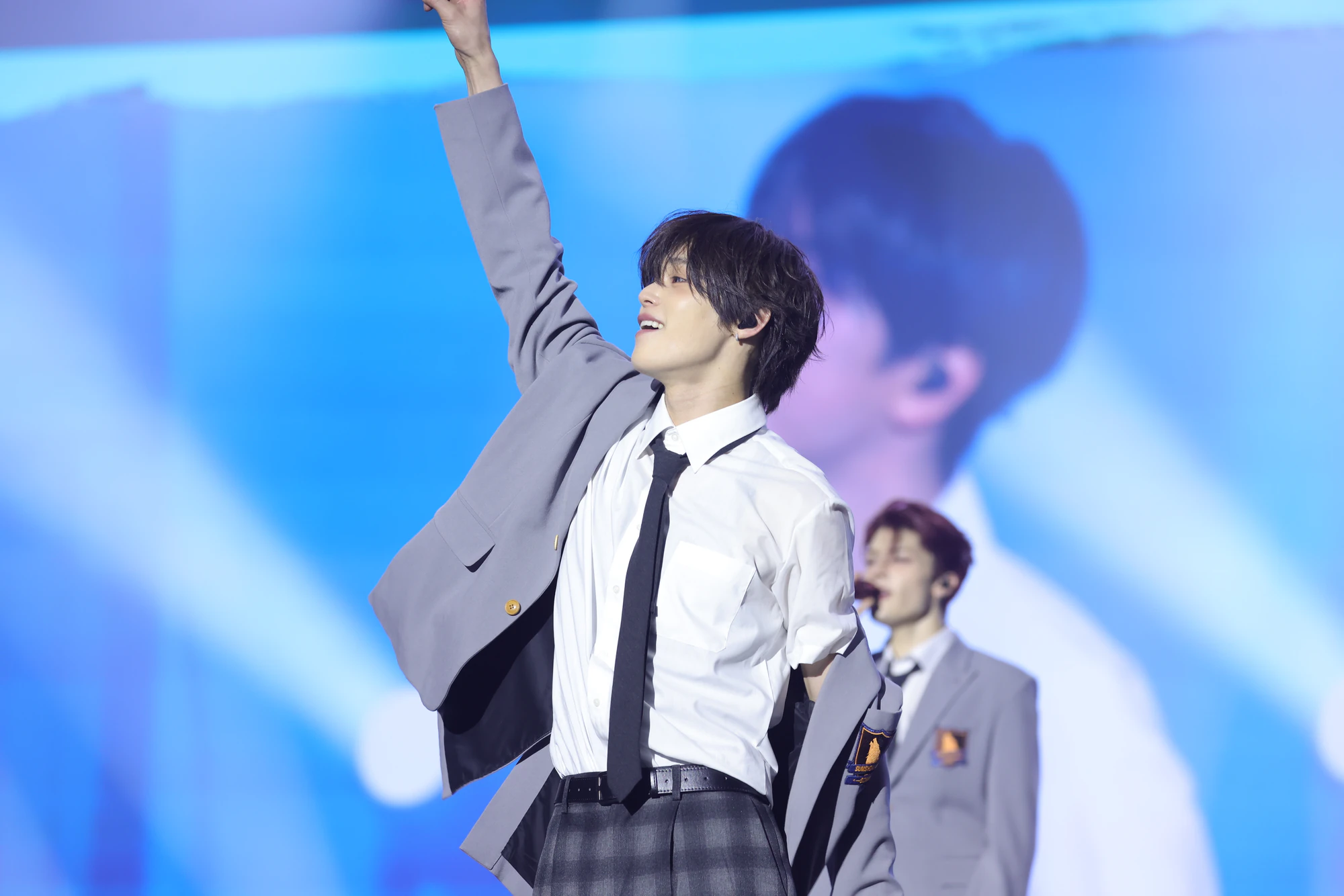 K performing on stage during a live performance.