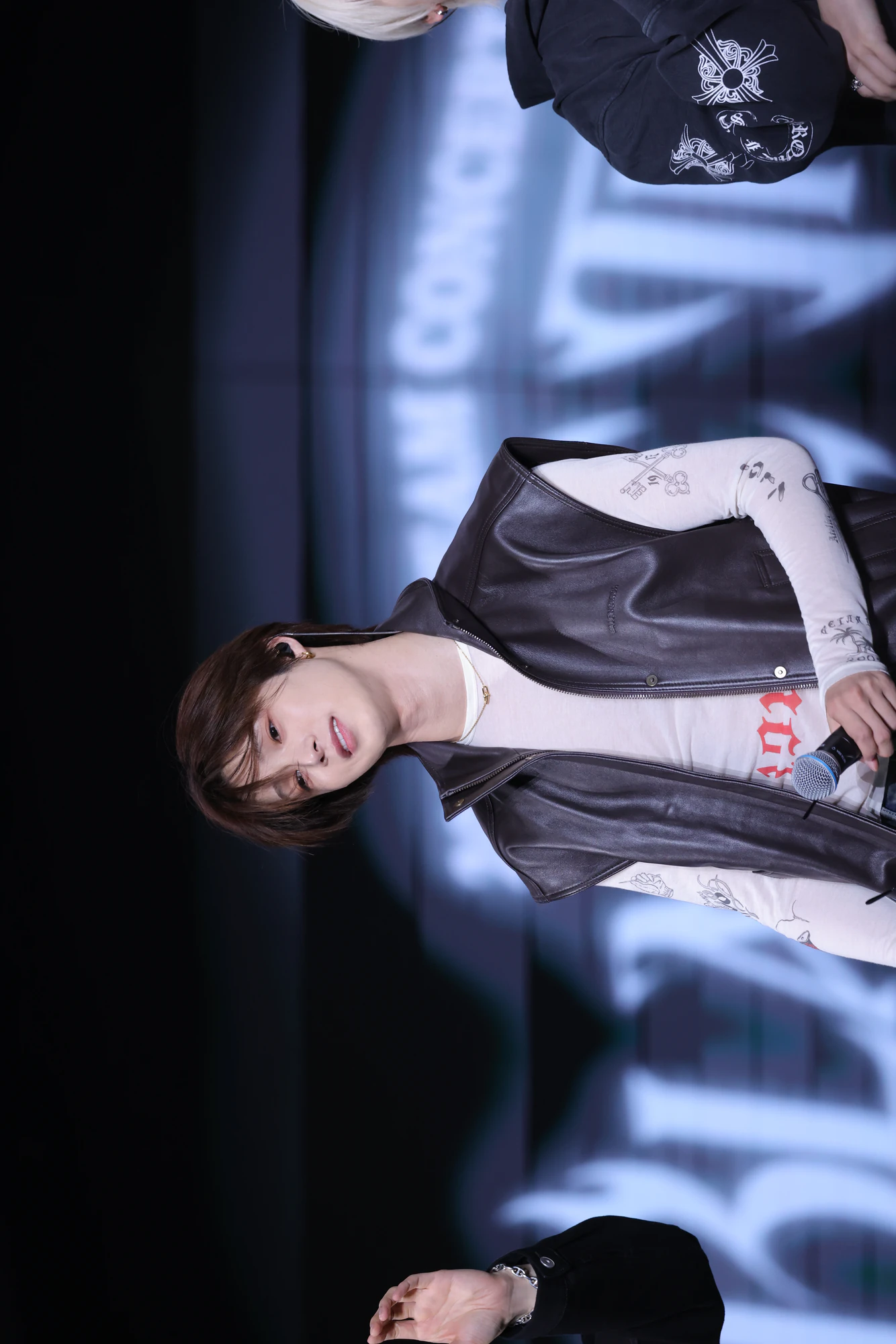 K performing on stage during a live performance.