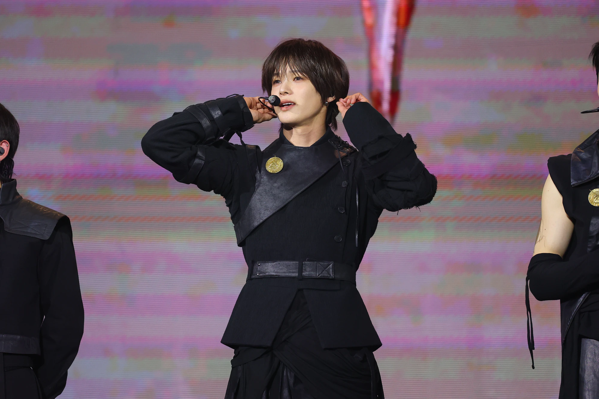 K performing on stage during a live performance.