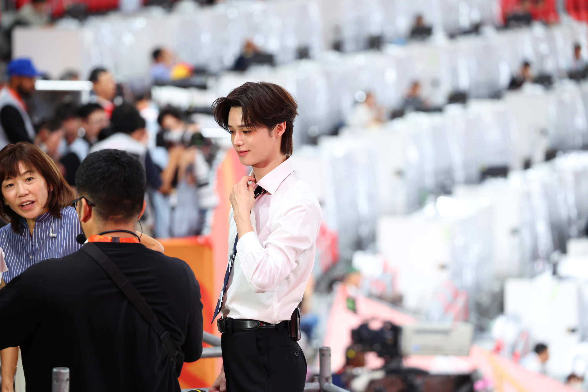 K greeting people during a public appearance.